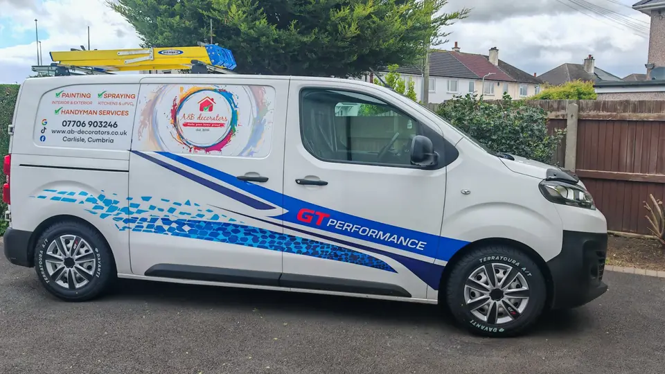 The A&B Decorators van: white van with the A&B decorators logo, painting, spraying and handyman services and phone number 07706 903246