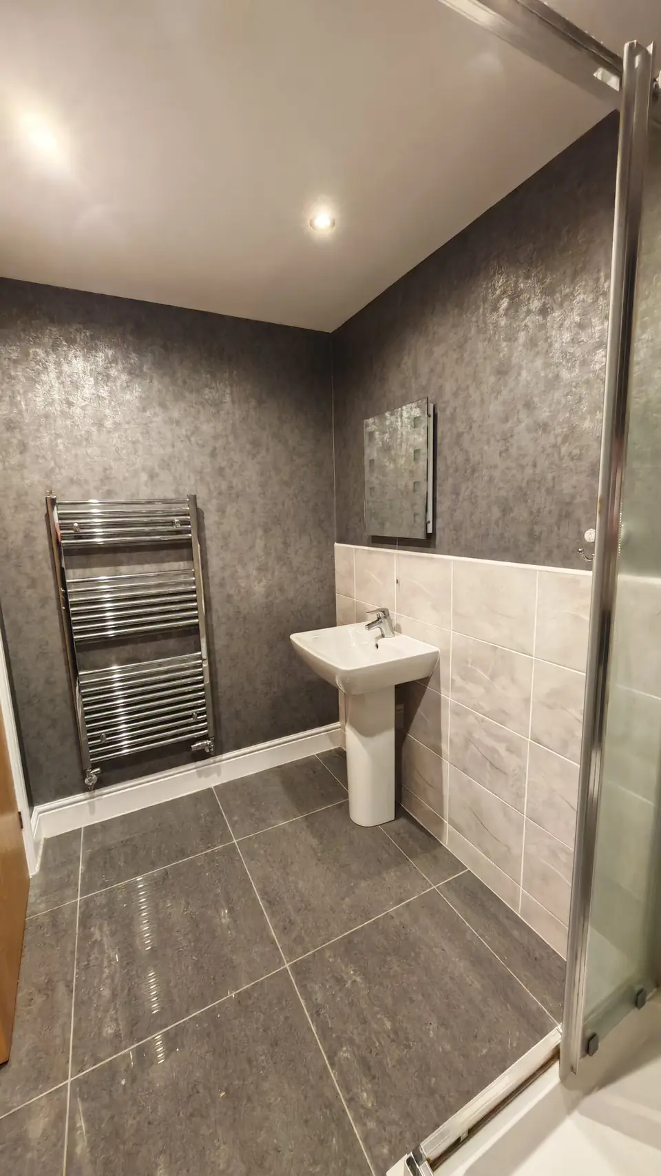 Bathroom in grey metallic wallpaper