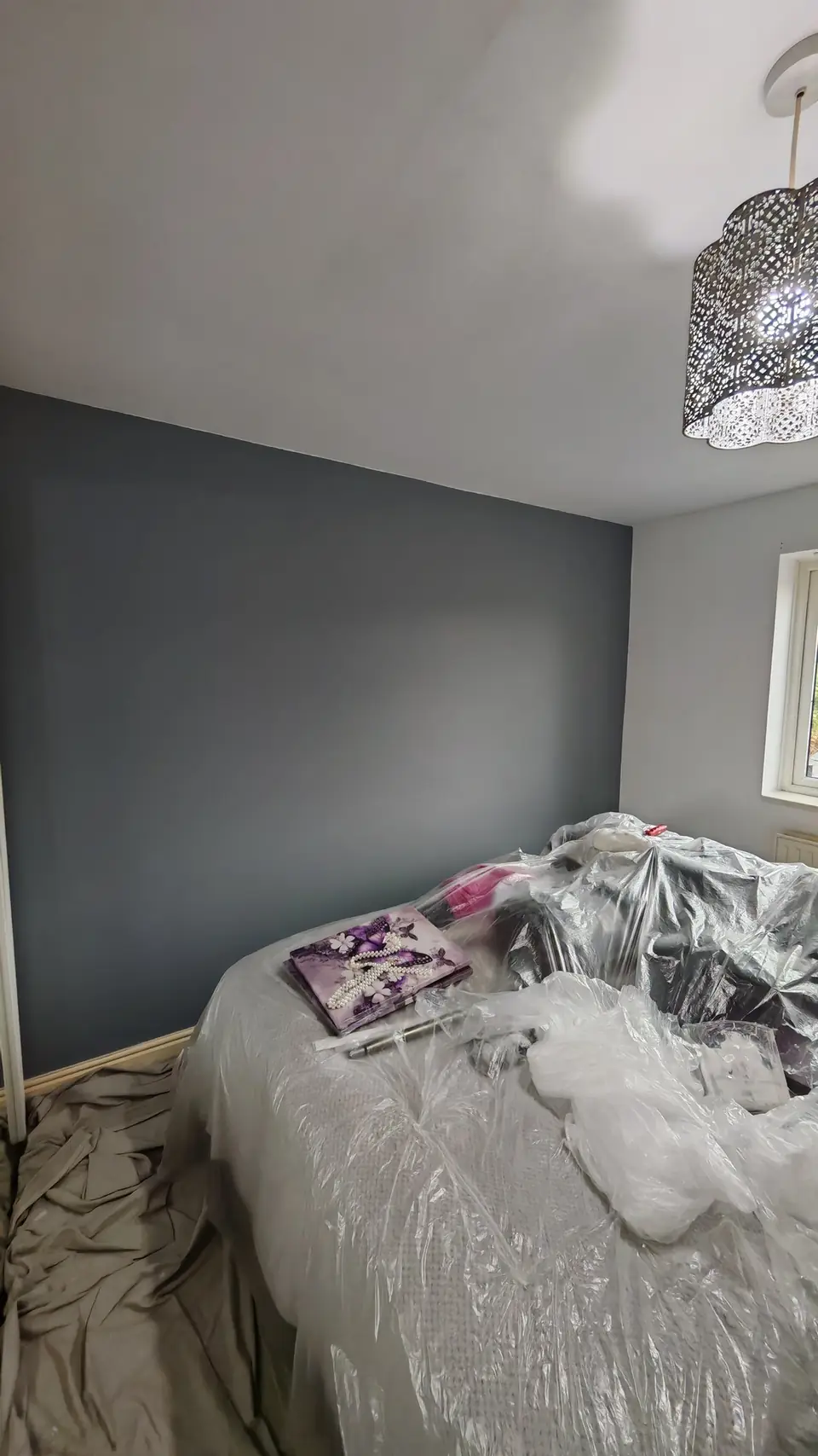 During: the dark grey feature wall going on