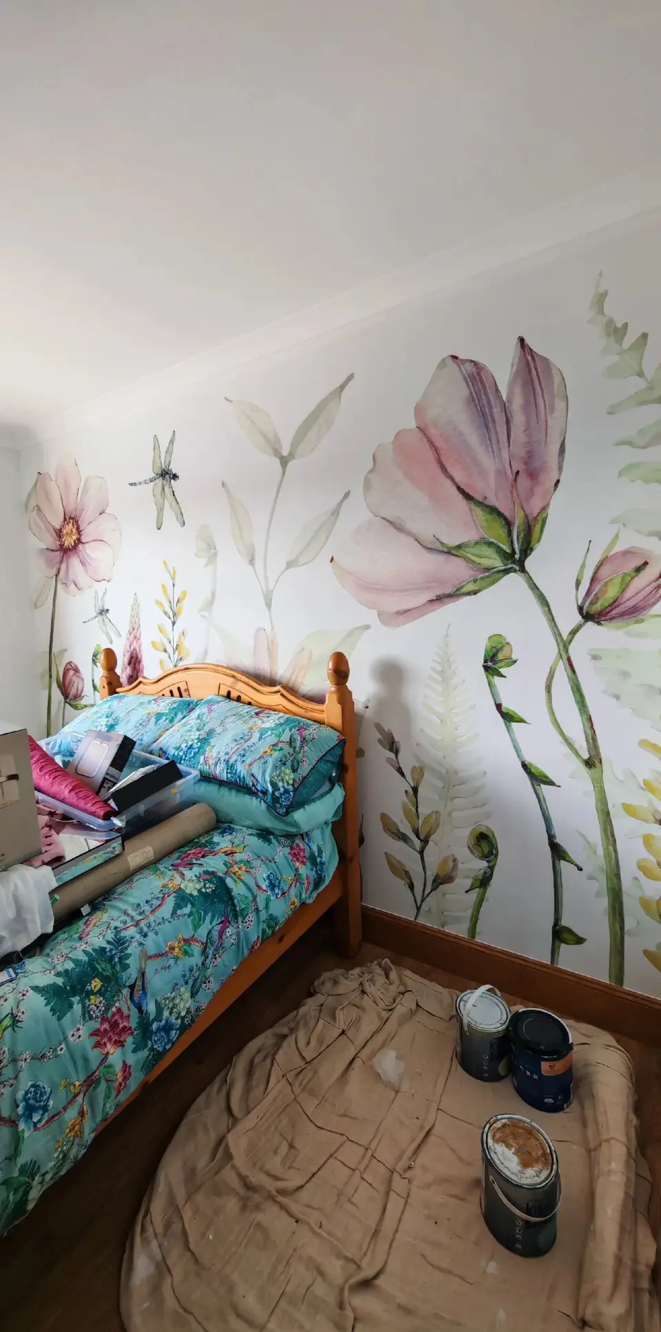 Bedroom feature wall with a watercolour floral mural