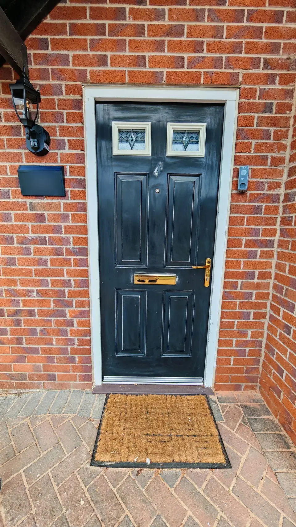During: fresh black gloss on the front door