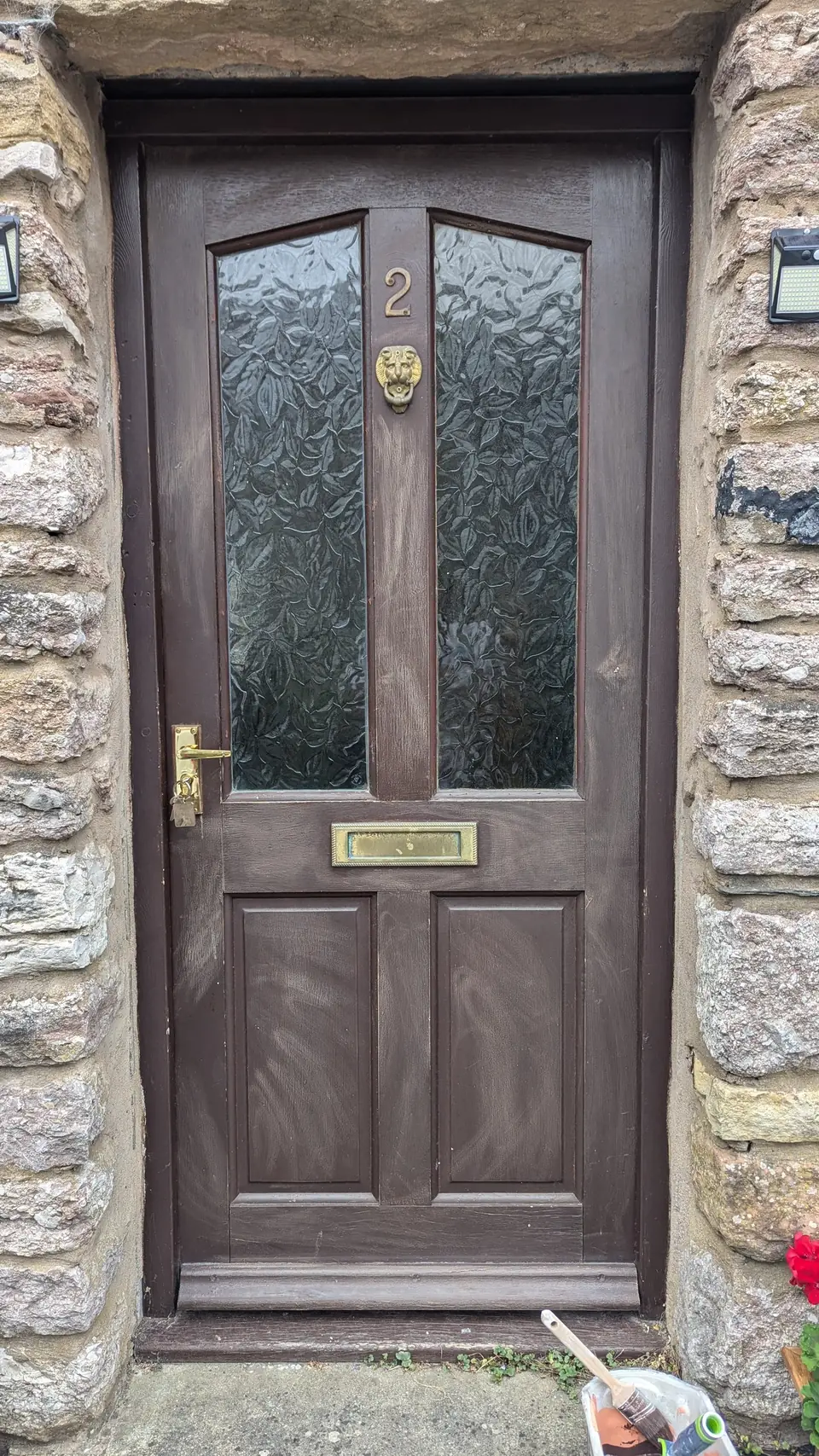 After: brown front door refinished