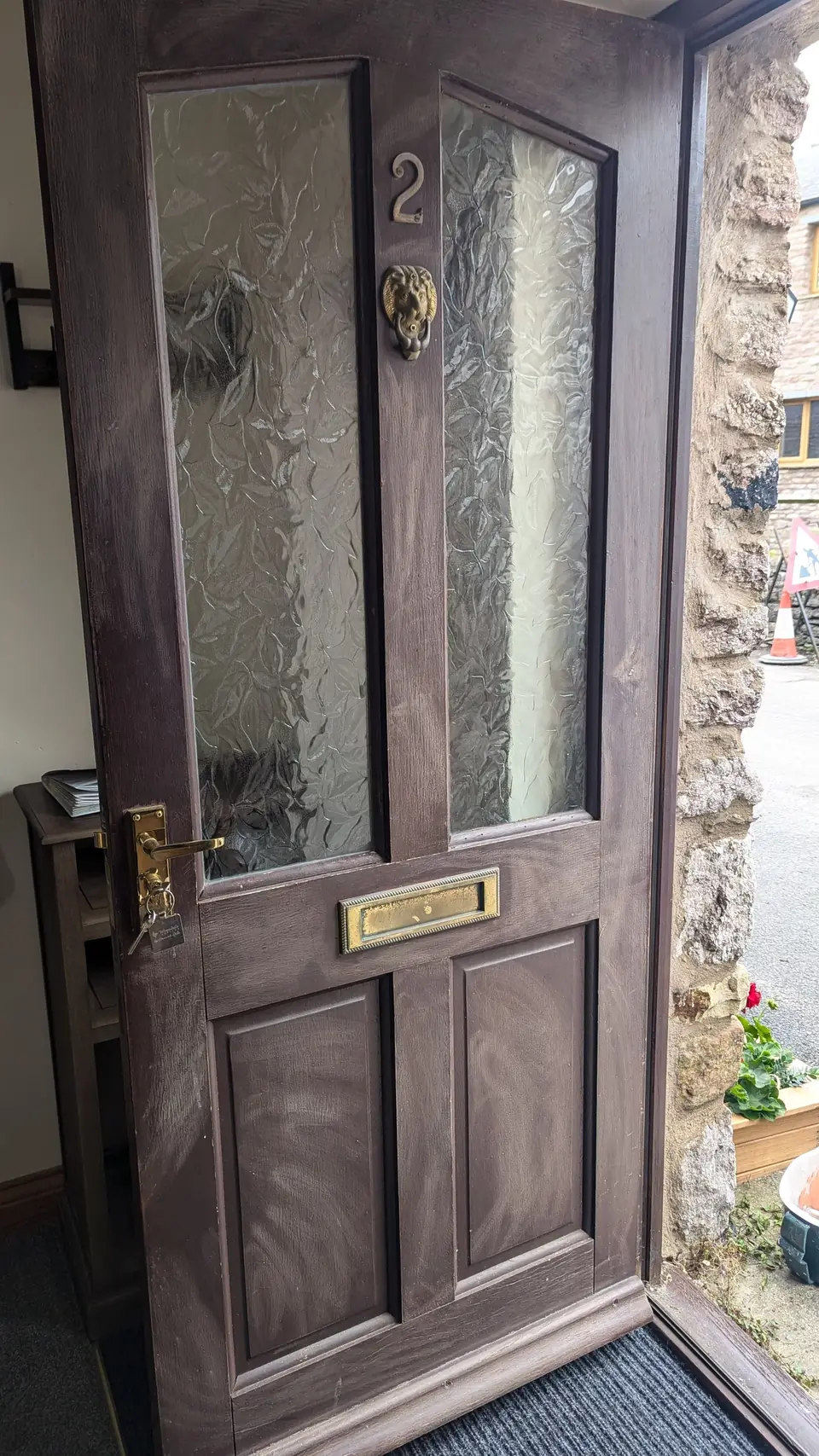 Before: worn brown front door