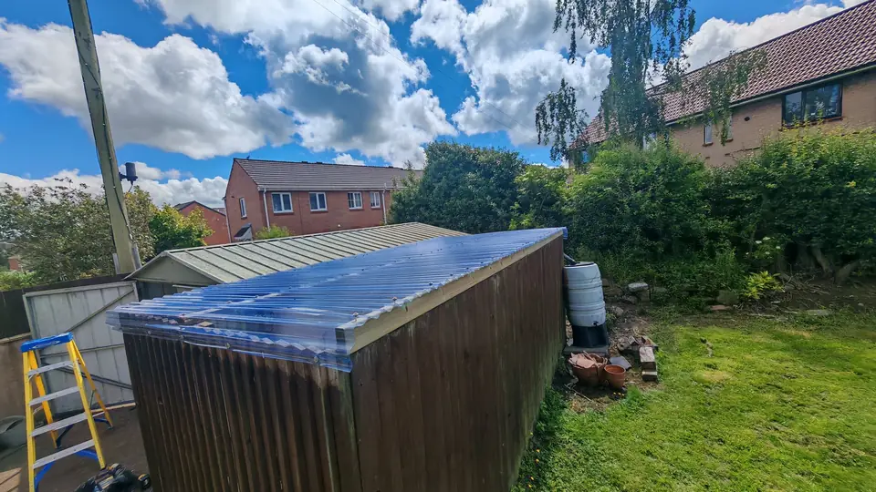Canopy roof replacement: new clear polycarbonate roofing on new timber battens
