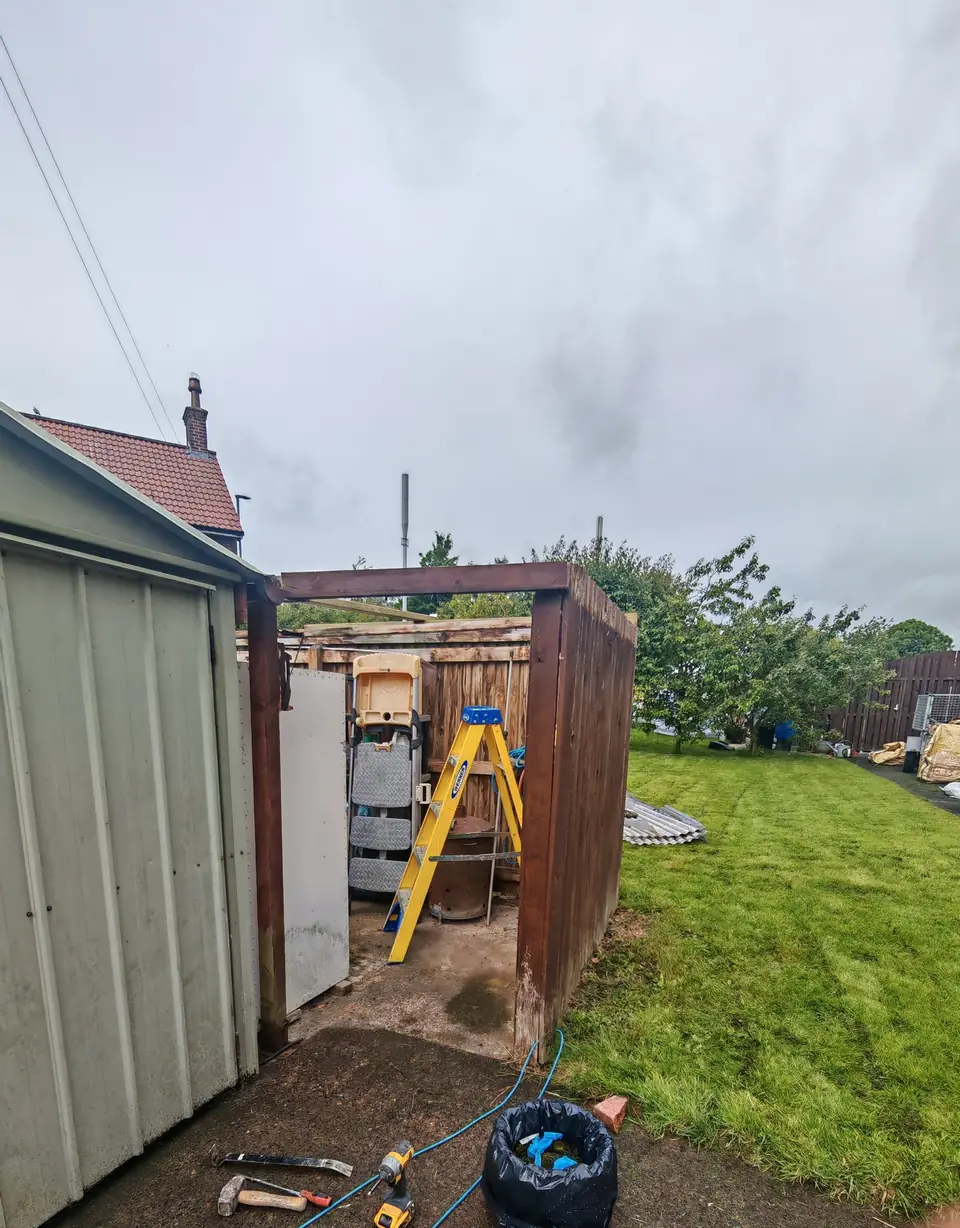 During: old roof sheets stripped back to the timber frame