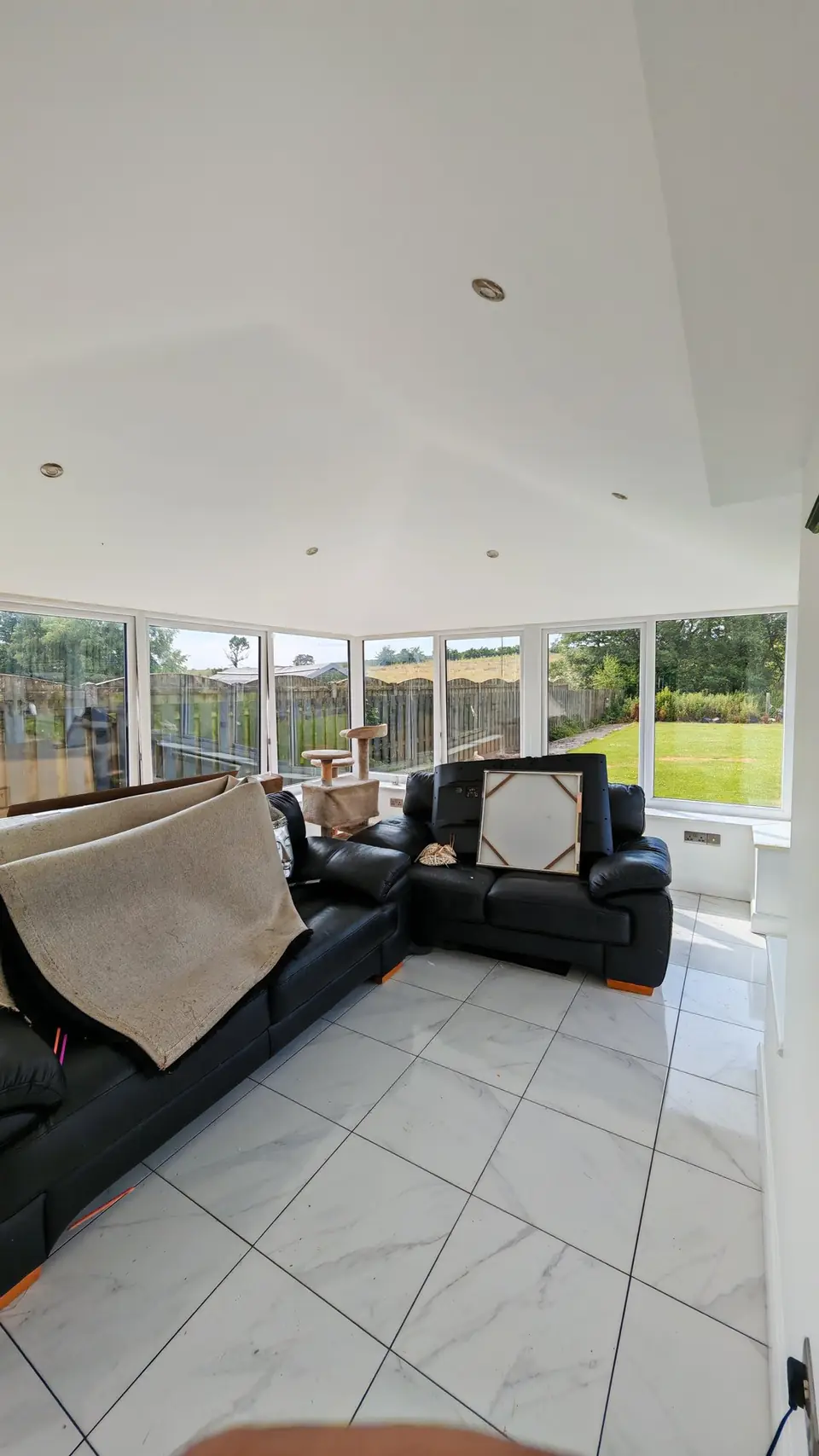 After: bright conservatory with freshly painted white walls