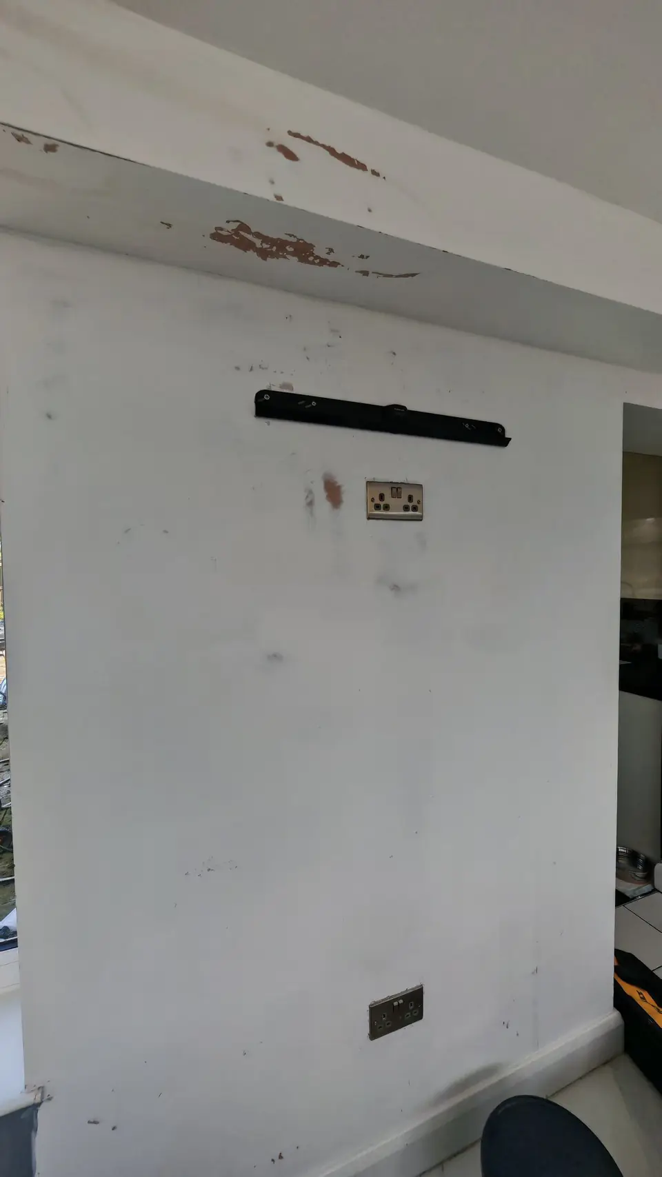 During: wall stripped back to bare plaster, marks ready for filling and prep