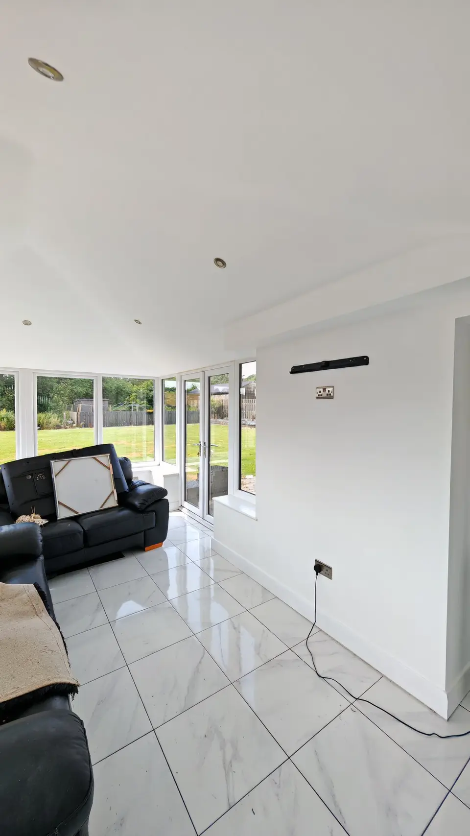 Conservatory wall stripped, prepped and painted white