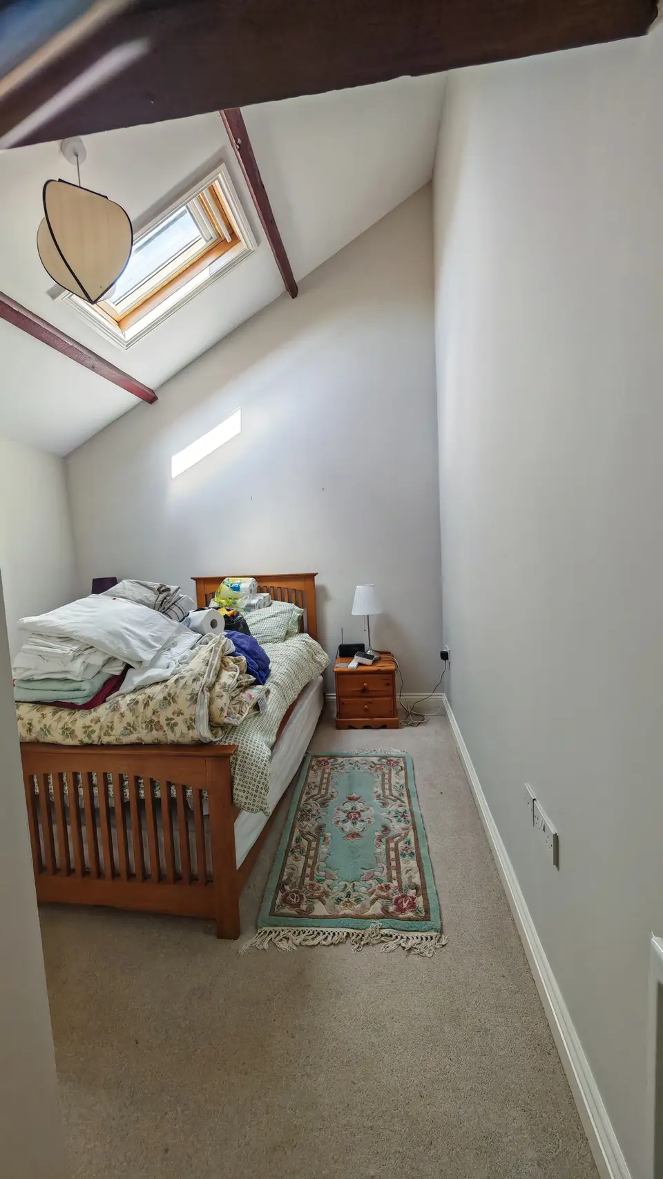 Cottage bedroom under the skylight