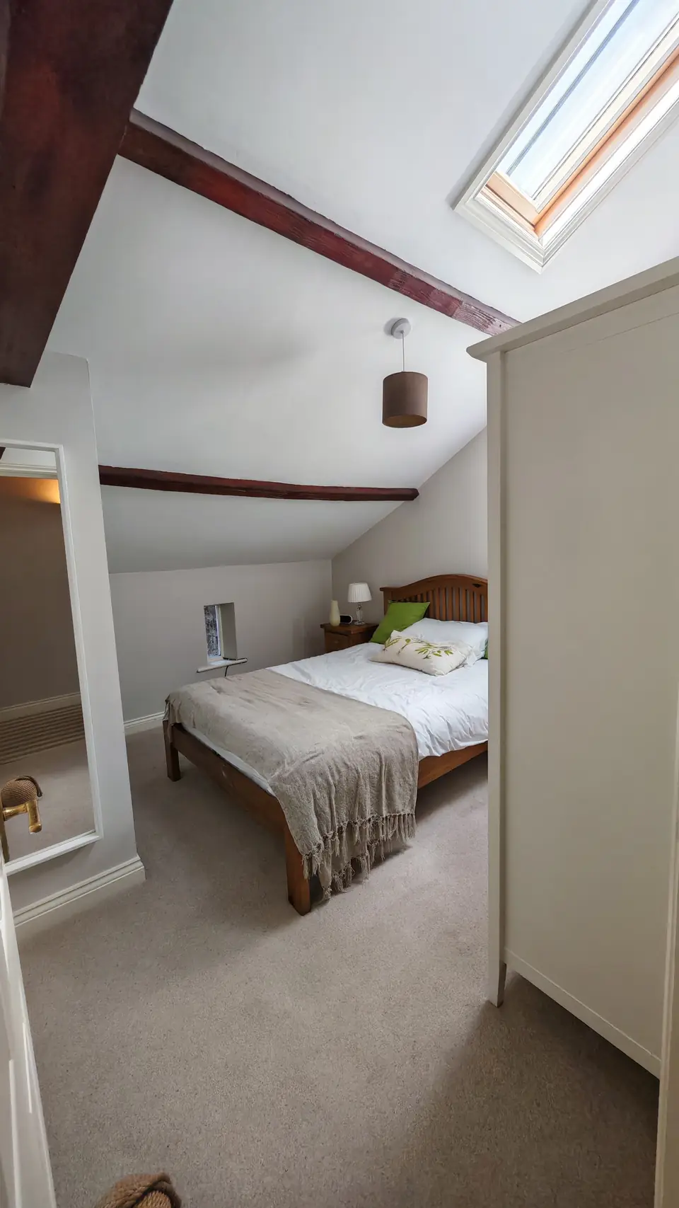 Second cottage bedroom with sloping ceiling