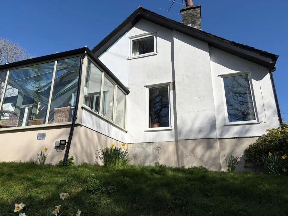 Before: the gable end beside the conservatory