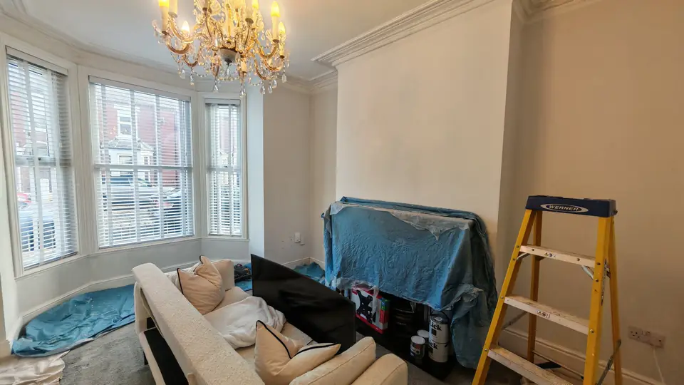 During: lounge prepared with dust sheets and step ladder