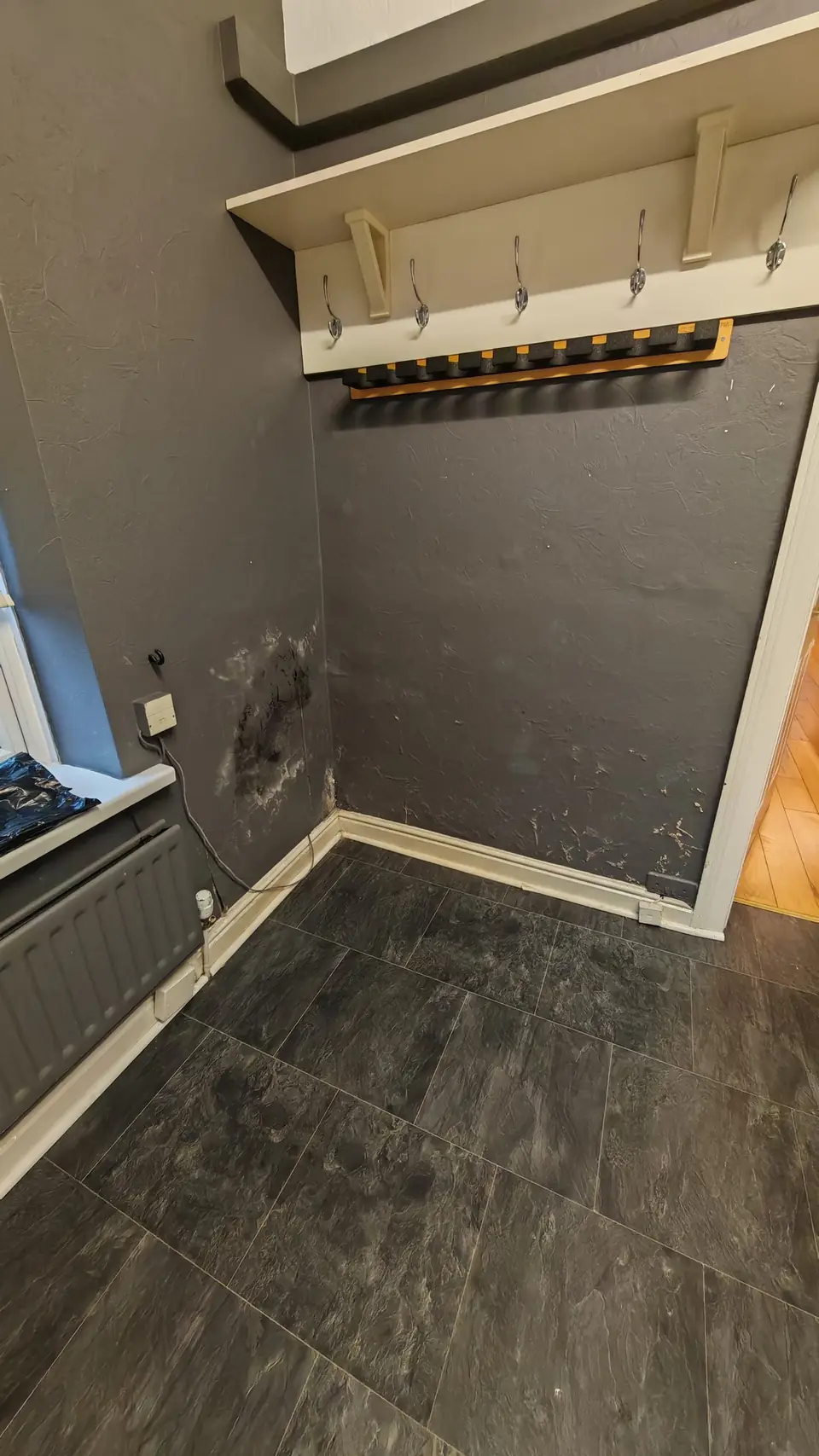 Before: damp staining showing through the wall finish