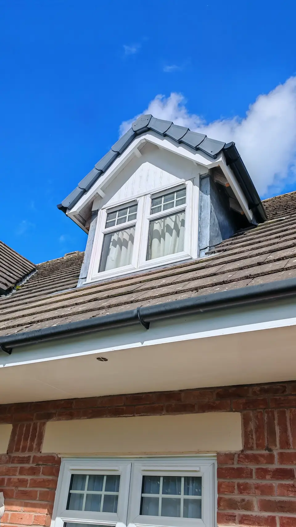 After: dormer cladding and woodwork glossed white
