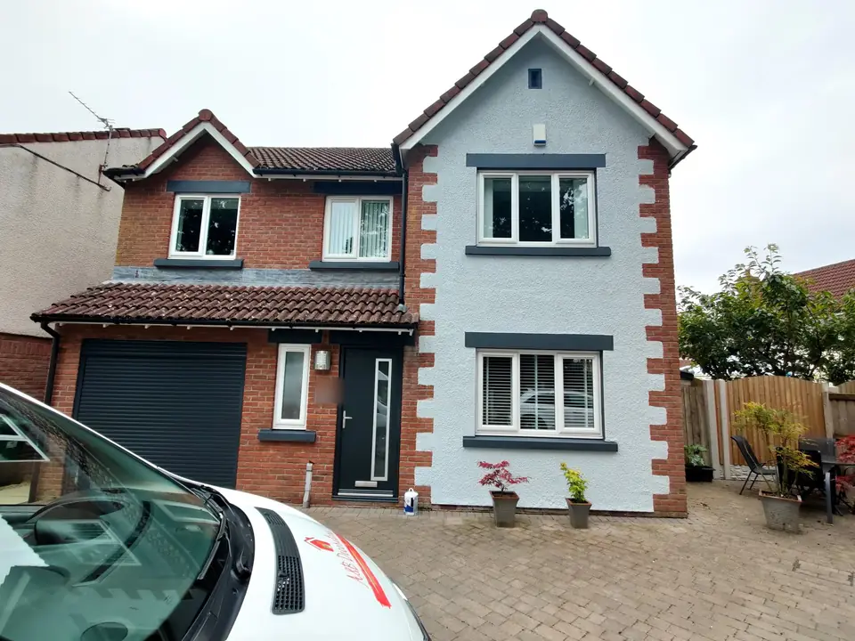 Detached house with freshly painted cream render