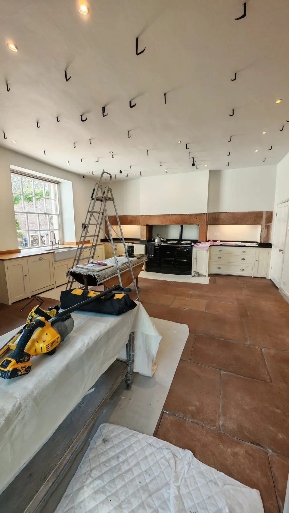 During: kitchen under dust sheets, ladder up for the ceiling