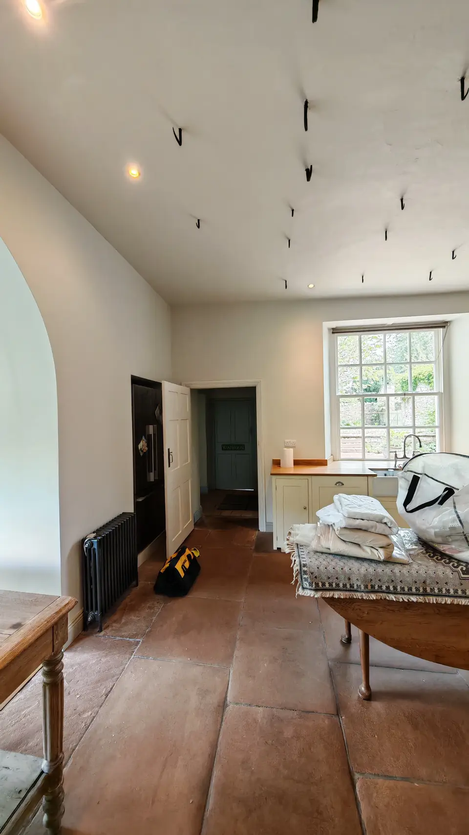 View from the kitchen to the hallway, walls in fresh white