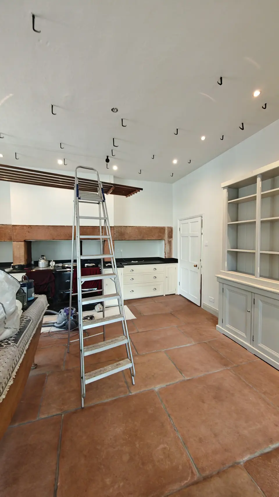 The kitchen ceiling and walls finished in white