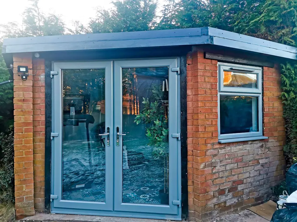 Garden room exterior with grey French doors