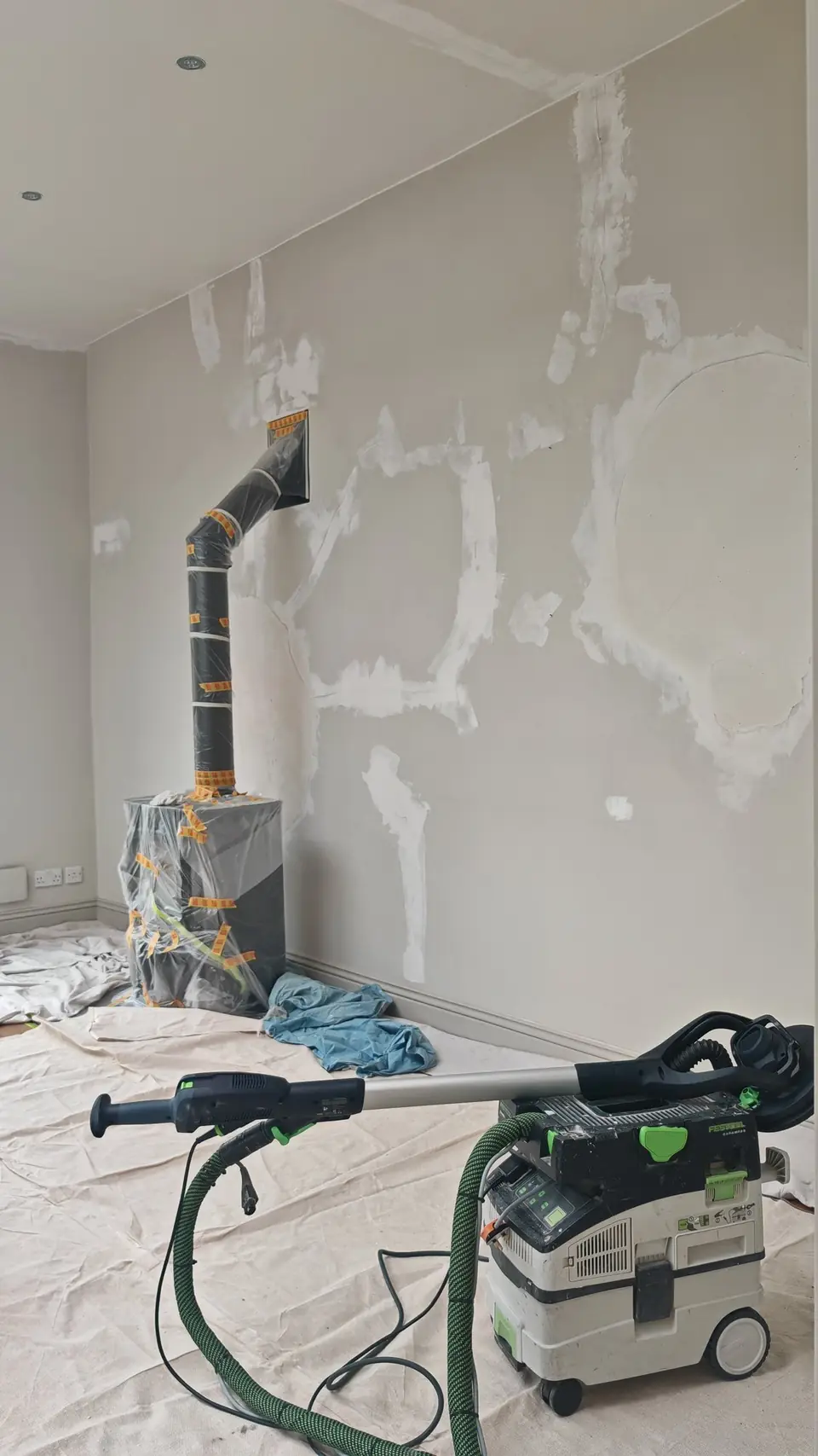 Prep: filled wall sanded with a Festool dust-extracted sander