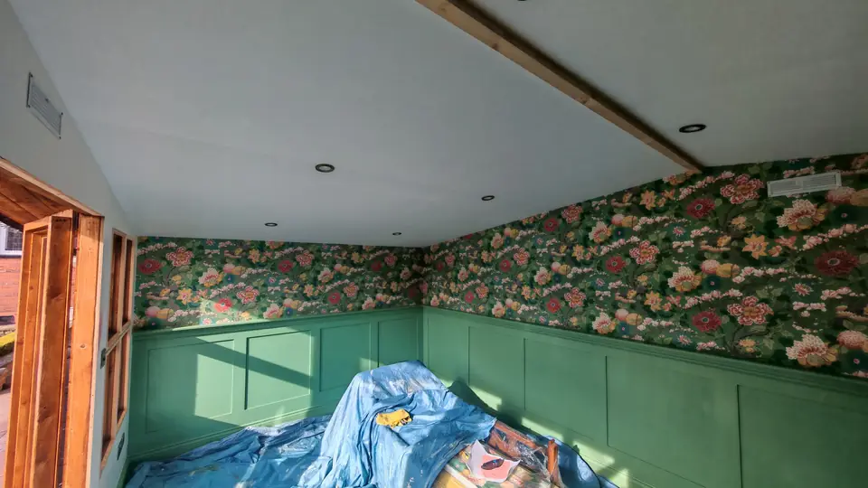 During: panelling painted, wallpaper going up