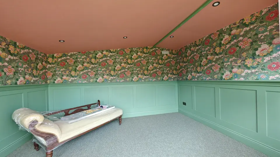Garden room panelling and floral wallpaper