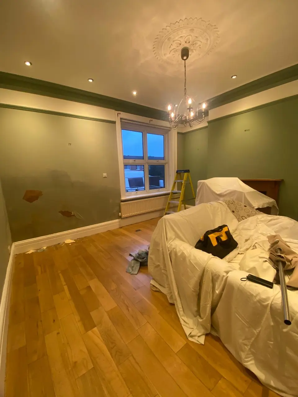Before: damp patches breaking through the wall by the window