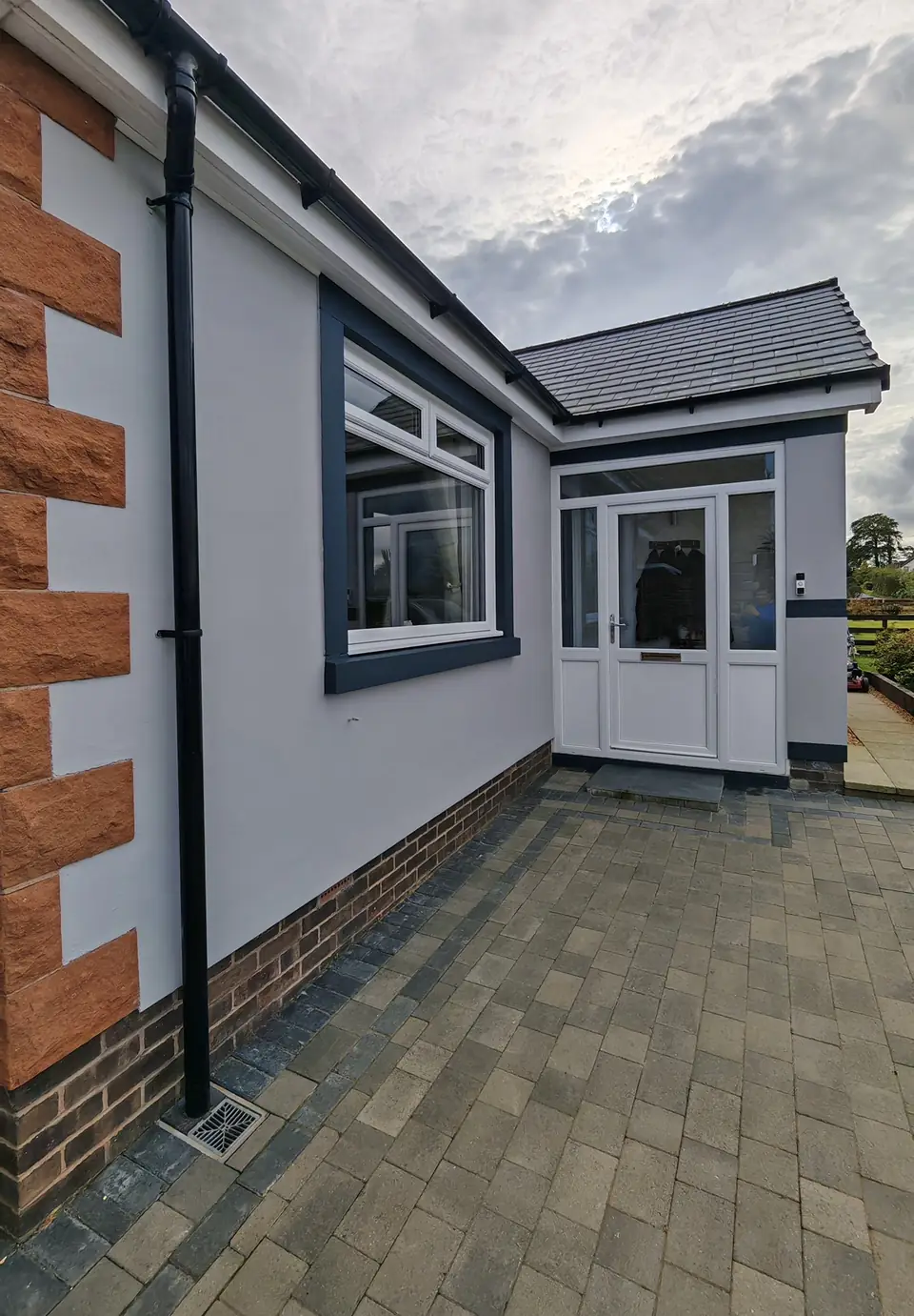 Grey rendered bungalow in Roadhead near Carlisle, exterior painted