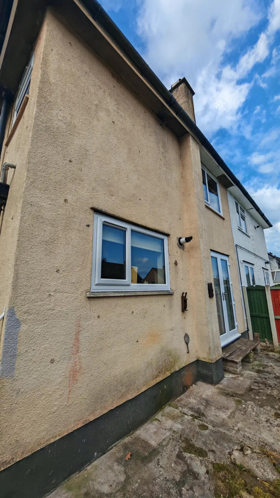 Before: rear elevation in the old cream render
