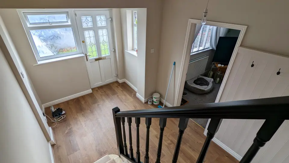 View down a freshly decorated hallway towards the front door