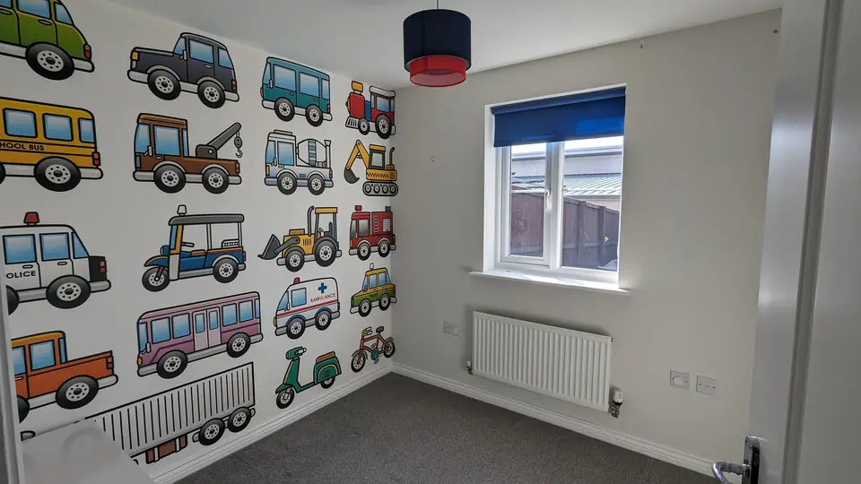 Kids bedroom with vehicles feature wall