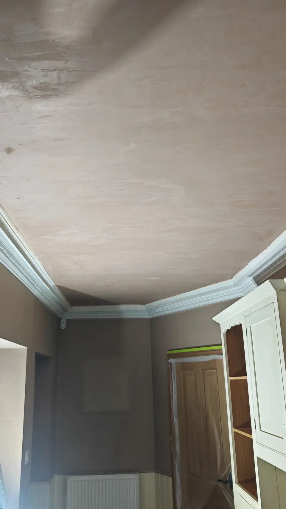 During: new plaster skim on the ceiling, units masked and floor protected