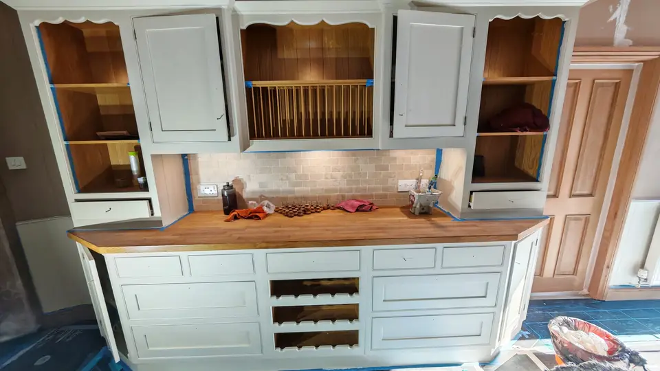 During: the dresser in light undercoat before its final sage green, oak worktop masked