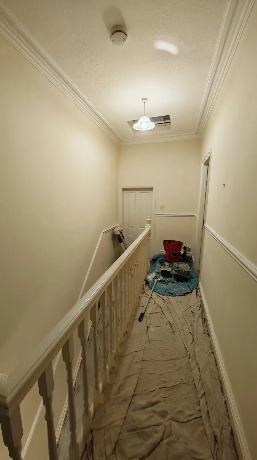 Before: magnolia landing corridor, carpet under dust sheets