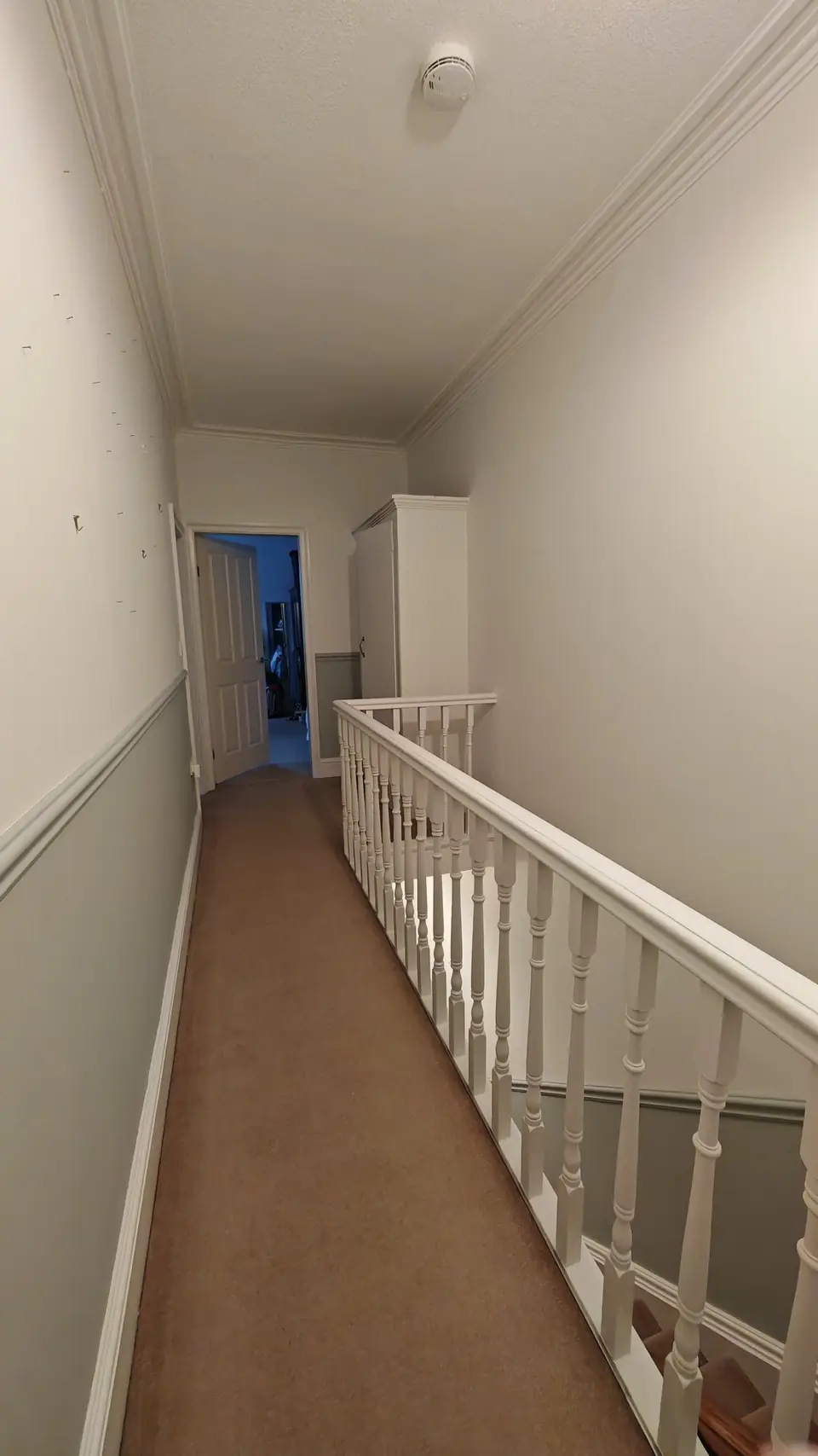 Landing corridor in grey-green and off-white, white gloss dado rail and skirting