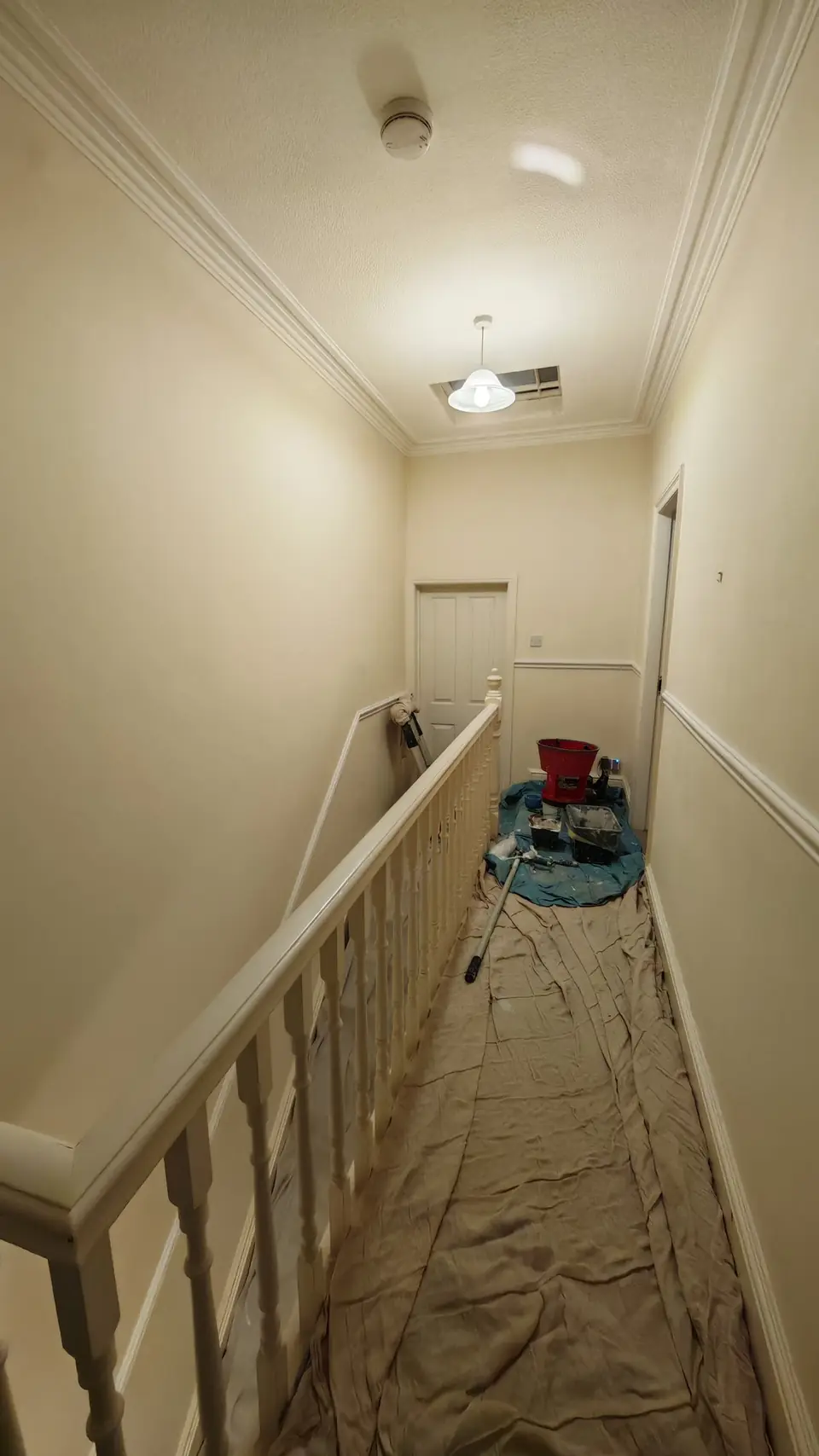 Before: magnolia landing, carpet under dust sheets