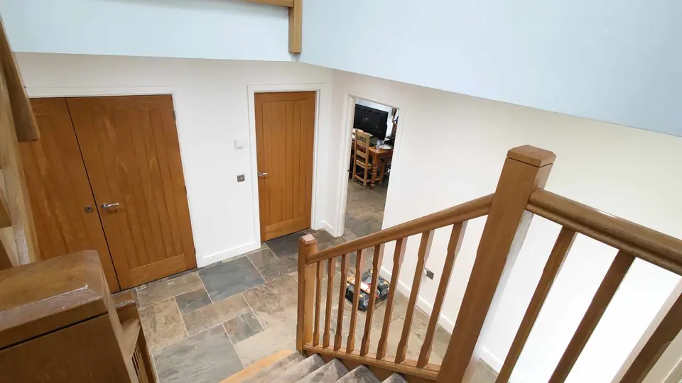 Landing with oak banister and freshly painted walls