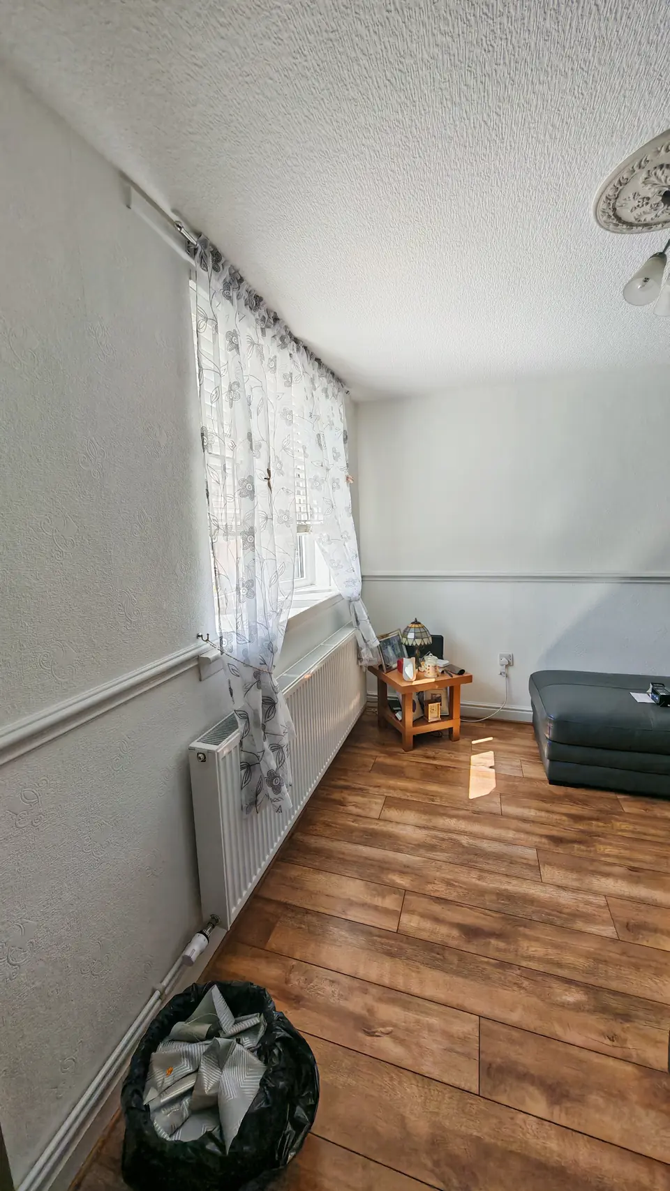Before: plain walls by the window, dust sheet down