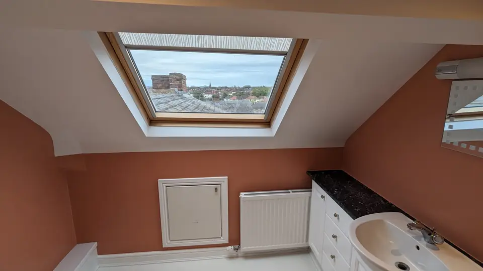 After: terracotta walls above the white vanity unit