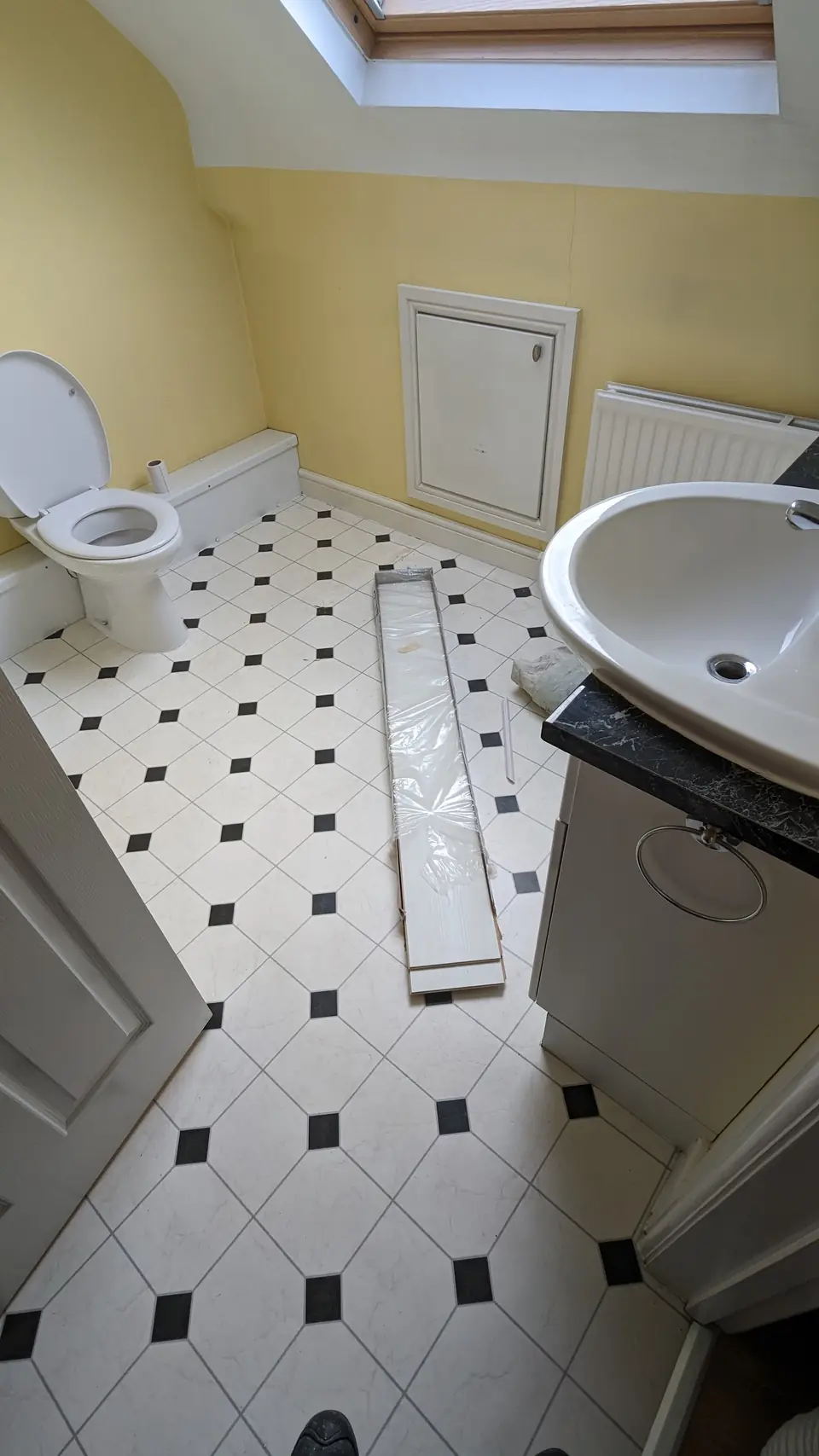 Before: yellow loft bathroom basin and toilet