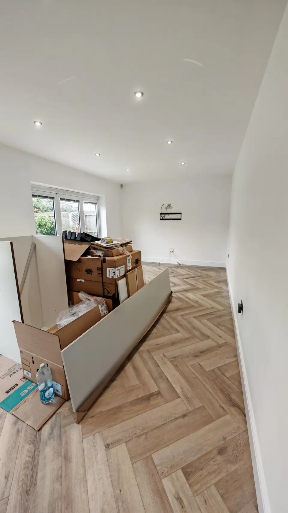 Herringbone LVT being laid in a new kitchen-diner