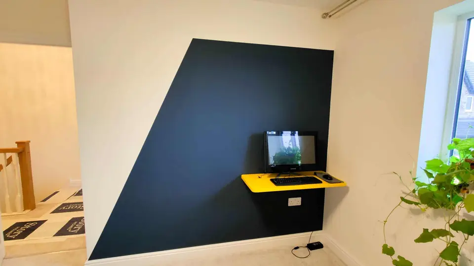 Navy geometric feature wall painted with crisp clean lines