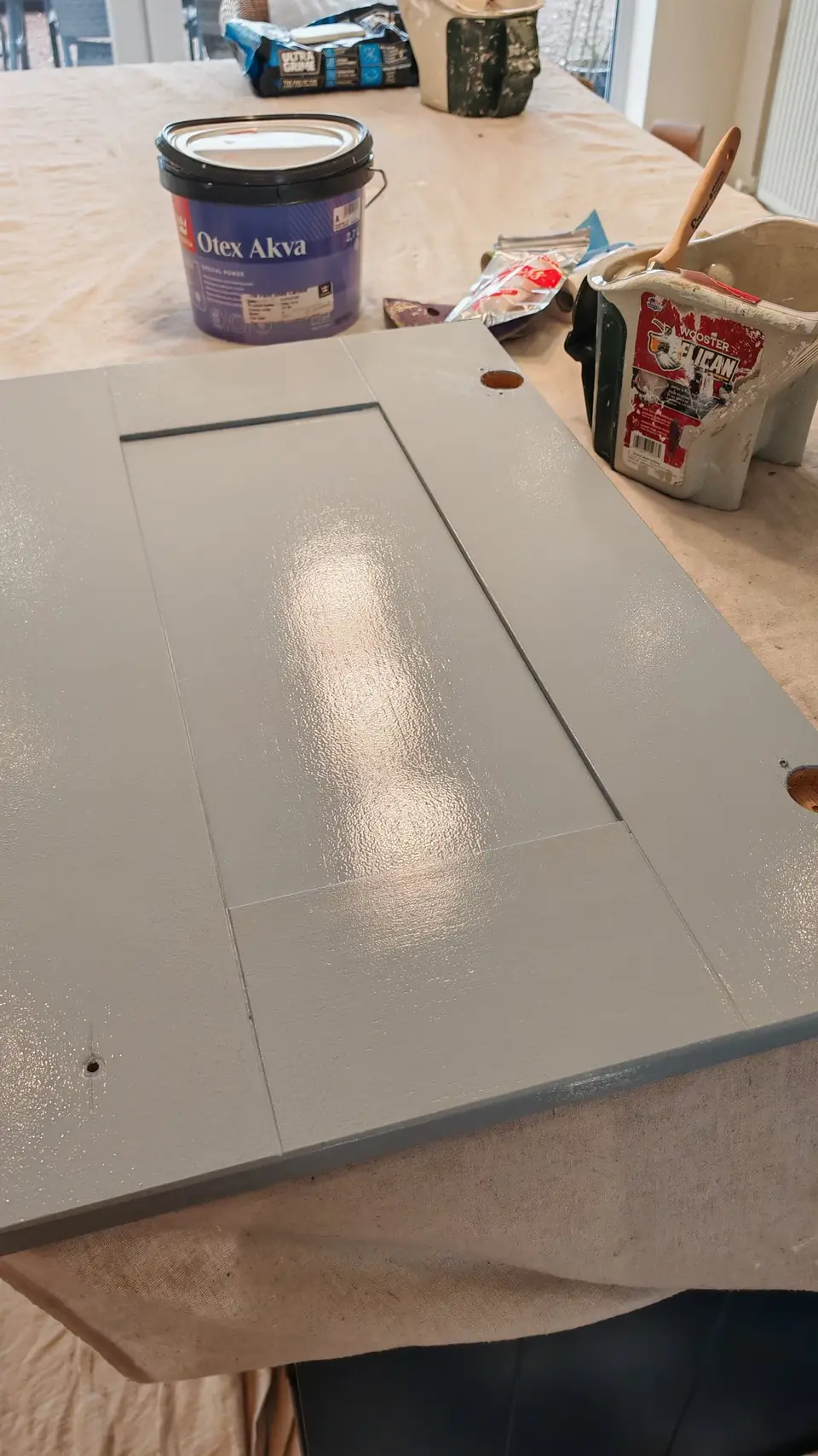 Finish coat: wet soft blue coat on a shaker door