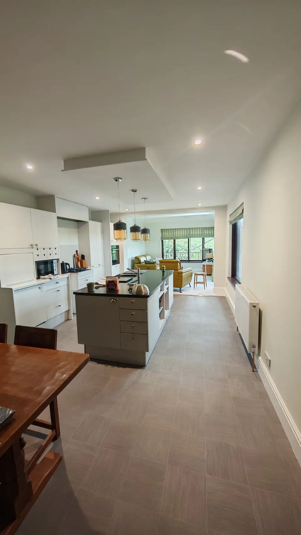 Long view from the kitchen through to the lounge, walls and ceilings freshly painted