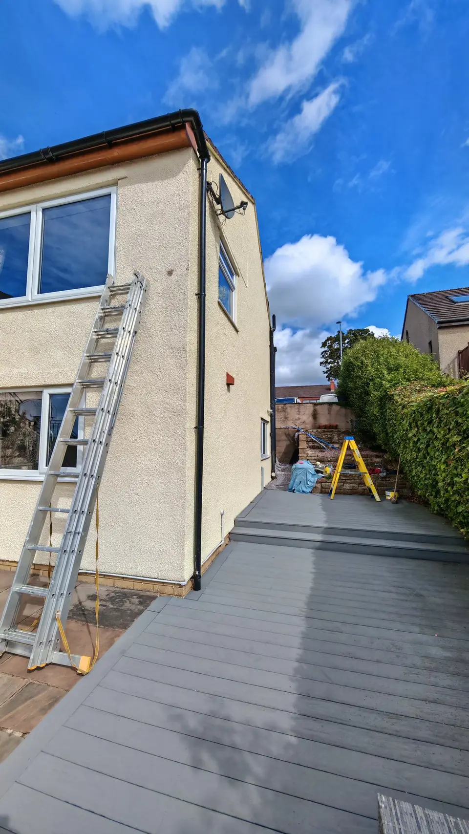 After: rear wall above the decking painted cream