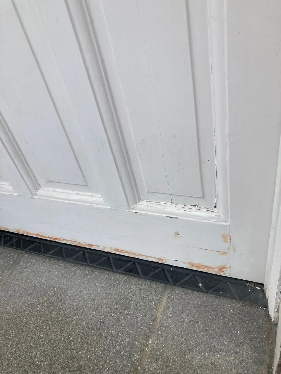 Before: cracked, flaking paint and bare timber on the bottom rail