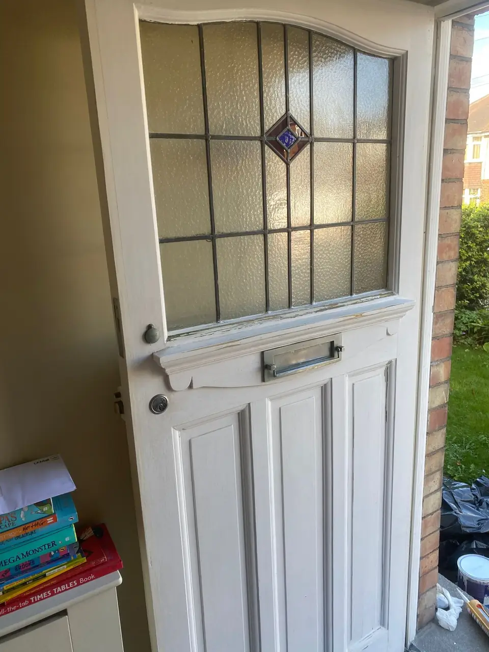 Before: tired, worn paint on the door edge and frame