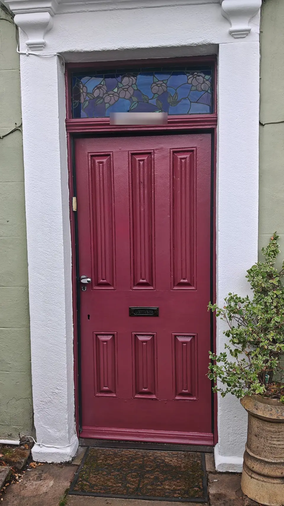 After: front door and fanlight frame glossed in burgundy, stone surround in brilliant white