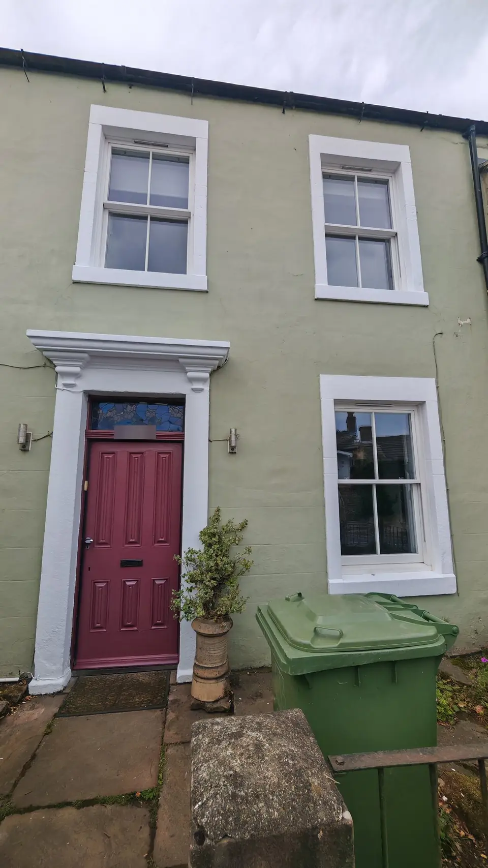 Period terrace: front door glossed in burgundy, stone surrounds and sash windows repainted, Carlisle
