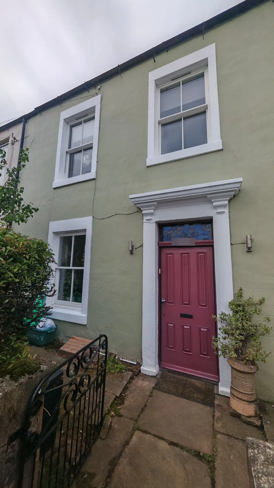 After: sage green terrace with white window and door surrounds